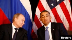 Russian President Vladimir Putin (left) and U.S. President Barack Obama hold talks in Mexico in June 2012.