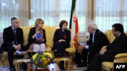 Iranian Foreign Minister Mohammed Javad Zarif (second right) and his deputy Seyyed Abbas Araghchi (right) in discussions with EU foreign policy chief Catherine Ashton (center) over Iran's nuclear program in Geneva on November 20.