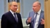 The firms targeted include a company owned by Russian billionaire Vladimir Potanin, pictured here with Russian President Vladimir Putin (left). 