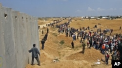 Demonstrators waved Palestinian flags during a protest at Rafah, on the border between Egypt and the southern Gaza Strip, on May 15.