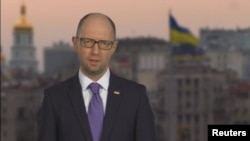 A screen shot of Ukrainian Prime Minister Arseniy Yatsenyuk announcing his resignation on national television. 