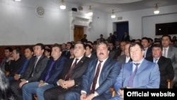 Tajik police attending the theater in Dushanbe on April 11 as ordered by their bosses.