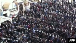 An image grab taken from a video uploaded on YouTube purporting to show antiregime protesters in Idlib on November 11.