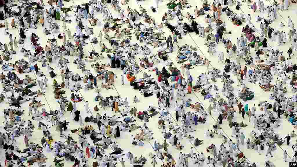 Muslim pilgrims await prayers at the Grand Mosque in Mecca, with their ranks swelled ahead of the official start of the hajj. (AFP PHOTO/FAYEZ NURELDINE)