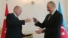 Azerbaijani President Ilham Aliyev (right) receives prayer beads from Turkish counterpart Recep Tayyip Erdogan in Baku during a visit in February.