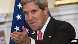 U.S. Secretary of State John Kerry is pressing the UN Security Council to pass a resolution including the threat of force if Syria fails to abide by a U.S.-Russian plan to place its chemical weapons under international control.