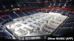 Serbian Army soldiers prepare a makeshift field hospital to accommodate patients infected by COVID-19 inside the Stark Arena in Belgrade on July 6.