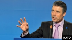 NATO chief Anders Fogh Rasmussen said the alliance had agreed on the approach to handing more responsibility for security to Afghans.