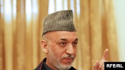 Afghan President Hamid Karzai is under pressure to devolve power to regional governors.