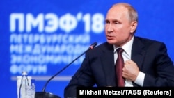 Russian President Vladimir Putin speaks during a session of the St. Petersburg International Economic Forum.