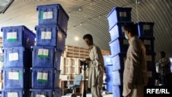 Election workers in Kabul load ballot boxes onto a truck in preparation for Afghanistan's presidential runoff election on November 7.