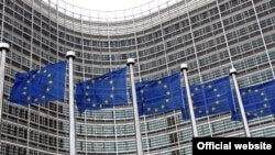 EU flags fly in front of the Berlaymont building in Brussels, which houses the European Commission's headquarters