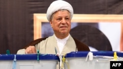 Iran's influential former president Akbar Hashemi Rafsanjani casting his ballot in presidential elections on June 12