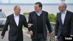 Russian President Vladimir Putin (left) walks with the president of the European Commission, Jose Manuel Barroso (center), and the president of the European Council, Herman Van Rompuy, during their meeting outside St. Petersburg on June 3.