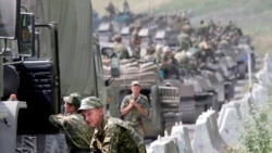 Russian soldiers pause on their way to Tskhinvali, South Ossetia, at the start of the August, 2008, conflict.