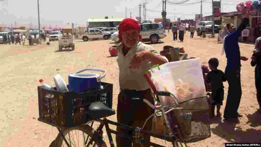 A man sells ice cream in the Domeez camp.