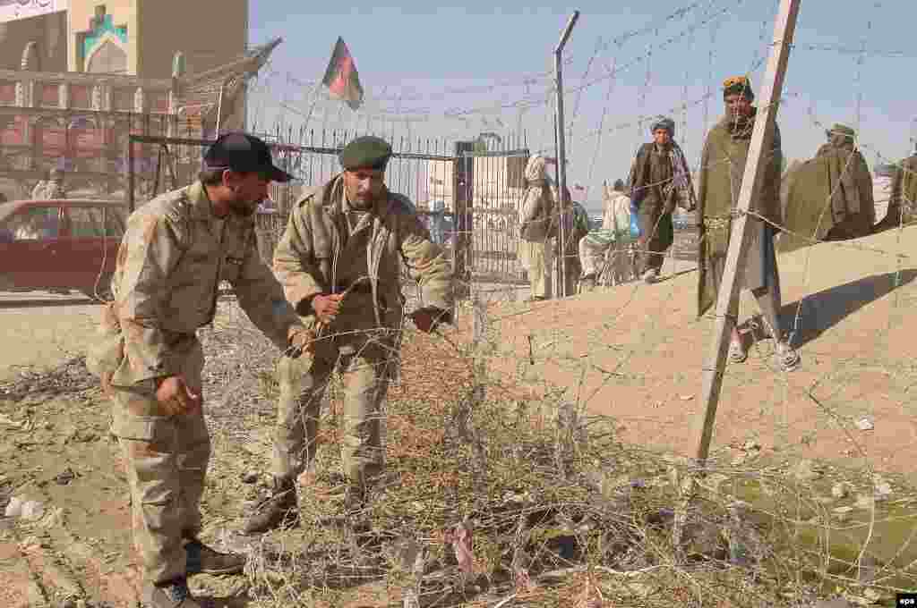 Pakistani troops fence part of the Afghan border near Chaman in January 2007 - Pakistan recently moved ahead with plans to fence portions of its border with Afghanistan despite fierce opposition from Kabul, where officials want to avoid any perception that they endorse the Durand Line. Islamabad defends the move by citing frequent Afghan accusations of Pakistani laxity, or even complicity, that allows cross-border attacks on the central government in Kabul.