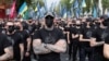 Veterans of the Azov Battalion and activists and supporters of the Azov civil corps march on Ukraine's Independence Day in Kyiv on August 24. A leader of the group welcomed the U.S. unrest in openly racist terms.