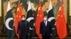 Pakistani Prime Minister Imran Khan and Chinese President Xi Jinping pose for a photo before their bilateral meeting at the Great Hall of the People on February 6. 