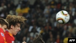 Action from a World Cup semifinal included Spanish defender Carles Puyol's (center) game-winning header in Durban on July 7.