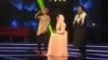 Afghan singer Zulala Hashemi (center) performs alongside competitors Sayed Jamal Mubarez (left) and Babak Mohammadi during the television music competition Afghan Star in Kabul in 2017.