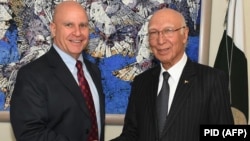 Sartaj Aziz (right) shakes hands with U.S. national security adviser H.R. McMaster in Islamabad in April.