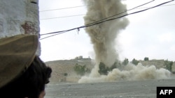 A tribesman watches a military strike in North Waziristan (file photo)