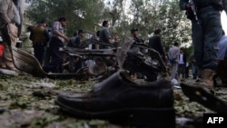 A victim's shoe lies on the ground as police secure the site of a suicide attack in Kabul last month.