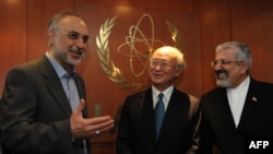 Iranian Foreign Minister Ali Akbar Salehi (left) and Iran's ambassador to the International Atomic Energy Agency (IAEA), Ali Asghar Soltanieh (right), meet with IAEA Director-General Yukiya Amano in Vienna in July 2011.