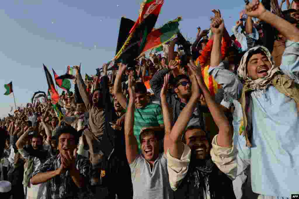 Spectators cheer during the match.