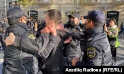 Protesters in support of Rustamli are rounded up in Baku on December 1.