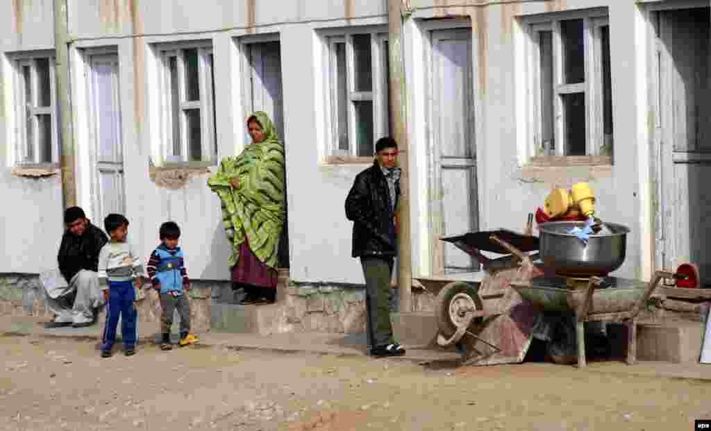 Refugees who were recently deported from Iran stand near temporary shelters in Herat, western Afghanistan, in November 2011. The UNHCR says there are Afghan refugees in 79 countries.