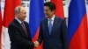 Putin Meets With Japan's Abe, Pledges 'Close Contacts' On North Korea