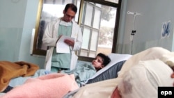 Children injured in the U.S.-led air strikes receive medical treatment at a local hospital in Farah Province on May 9.