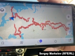 Sharashkin shows waypoints recorded on his phone since setting off on foot in 2018.