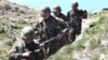 Armenian soldiers take up positions on the border with Azerbaijan on May 17.