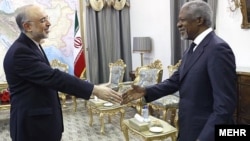 Iranian Foreign Minister Ali Akbar Salehi (left) greets UN/Arab League Syria envoy Kofi Annan in Tehran on April 11.