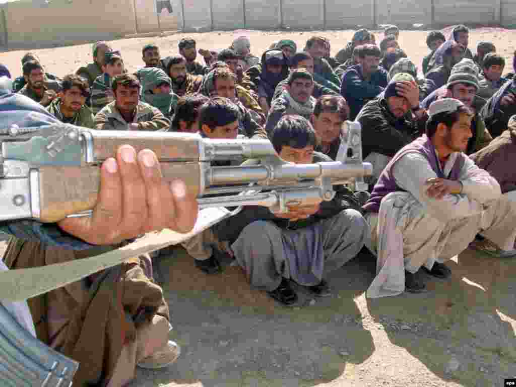 Afghan nationals brought to Pakistan's Chaman border-crossing for handover to Afghan authorities after their detention for traveling on false documents - Critics claim that Osama bin Laden and Al-Qaeda have exploited the lack of central authority and local sympathies in Pakistan's border regions to provide a haven for their terrorist activities. Their suspected presence has kindled animosity among three declared allies in the U.S.-led counterterrorism effort: Kabul, Islamabad, and Washington. 