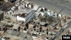 Destroyed homes in a residential area of Osh in mid-June