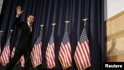 U.S. President Barack Obama, seen waving as he leaves following the National Defense University speech on March 28, said the U.S. will hand over lead command this week of the Libyan mission to NATO.