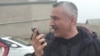 Fuad Qahramanli talks on the phone after being released from prison in March 2019.