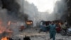 Dozens Killed In Peshawar Blasts