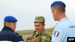 A Russian soldier speaking with EU Monitoring Mission members earlier this month