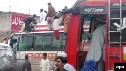 Local residents flee Mingora, in the Swat Valley, on May 5.