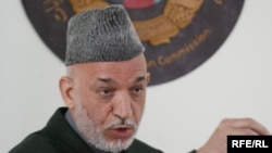 Afghan President Hamid Karzai speaks at the Independent Electoral Commission compound in Kabul on April 1.