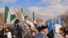 Protesters rally in front of the White House to press human rights concerns during Chinese President Hu Jintao's state visit, January 19