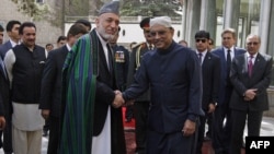 Afghan President Hamid Karzai and his Pakistani counterpart, Asif Zardari, were trying to overcome mutual distrust on the first day of talks in Istanbul.