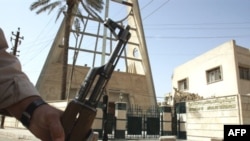 A security guard stands in front of the Syrian Catholic Church in Baghdad's district of Karrada.