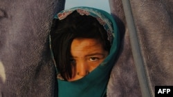 A child at a camp for returning refugees in Qala-e Qul Mohammad on the outskirts of Mazar-e Sharif, Afghanistan, in April