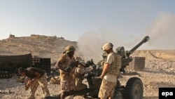 British troops in Afghanistan fire at Taliban positions in September.